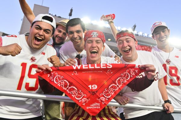 Boston College fans hold up a red bandanna for Welles Crowther before Friday's game. The Red Bandanna Game is held in honor of Crowther, a former lacrosse player who died rescuing more than a dozen people in the South Tower of the World Trade Center.