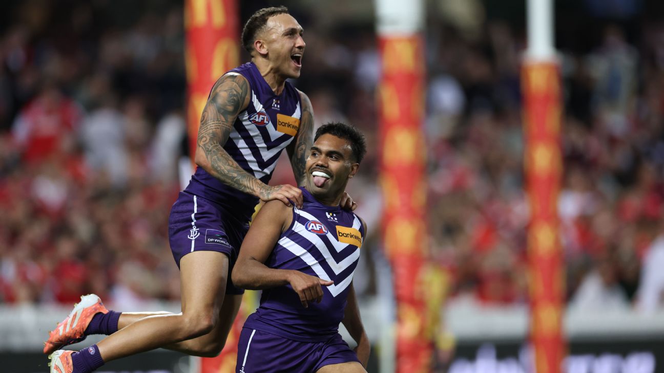 Isaiah Dudley celebrates his match-sealing preliminary final goal with Shai Bolton. — Article image accompanying AFL's smallest player sets sights on biggest stage on WagerUp Sports News. Isaiah Dudley celebrates his match-sealing preliminary final goal with Shai Bolton. — Article image accompanying AFL's smallest player sets sights on biggest stage on WagerUp Sports News.