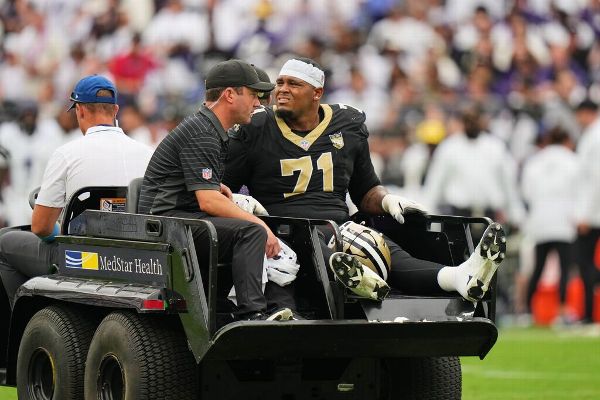 Article image accompanying Saints LT Kelvin Banks Jr. carted off with ankle injury on WagerUp Sports News.