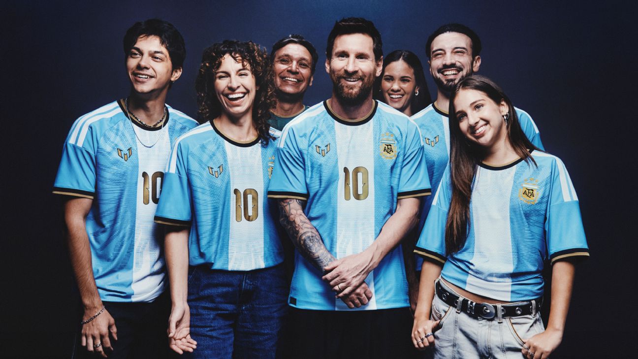 Group shot of people wearing special kit for Lionel Messi's final Argentina match