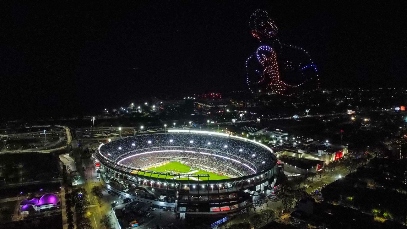 A drone show shows Lionel Messi holding the World Cup trophy following his final appearance for Argentina.