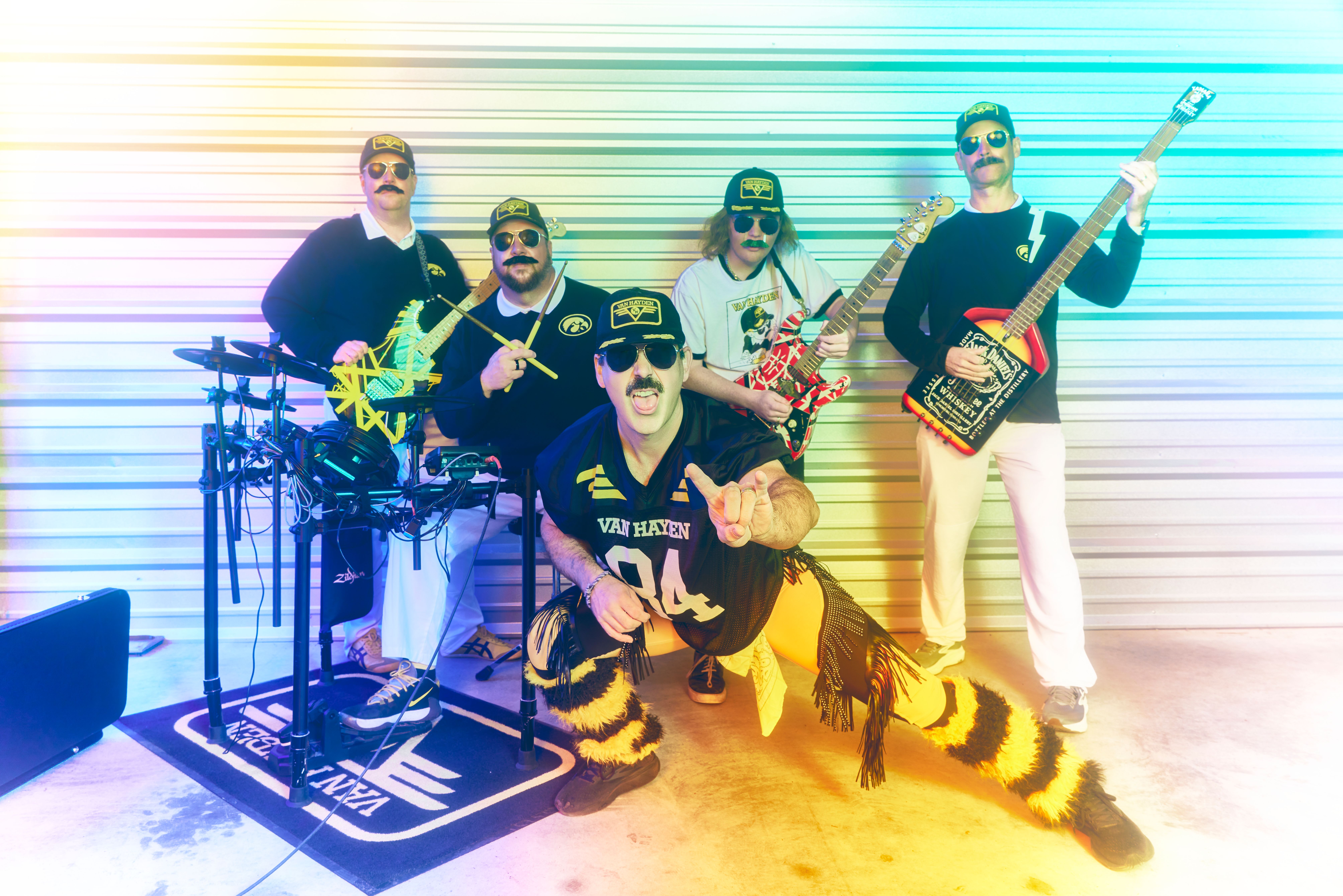 Andy Olson (Eddie Van Hayden), Jake Olson (Alex Van Hayden), 15-year-old Masen Funk (The Pasadena Kid) and Brent Buresh (Michael Van Hayden) lay down the grooves while Robby Marvin, front, gets the crowd going as Hayden Lee Roth. — Article image accompanying How Iowa ended up with Van Hayden, college football's most unique cover band on WagerUp Sports News. Andy Olson (Eddie Van Hayden), Jake Olson (Alex Van Hayden), 15-year-old Masen Funk (The Pasadena Kid) and Brent Buresh (Michael Van Hayden) lay down the grooves while Robby Marvin, front, gets the crowd going as Hayden Lee Roth. — Article image accompanying How Iowa ended up with Van Hayden, college football's most unique cover band on WagerUp Sports News.