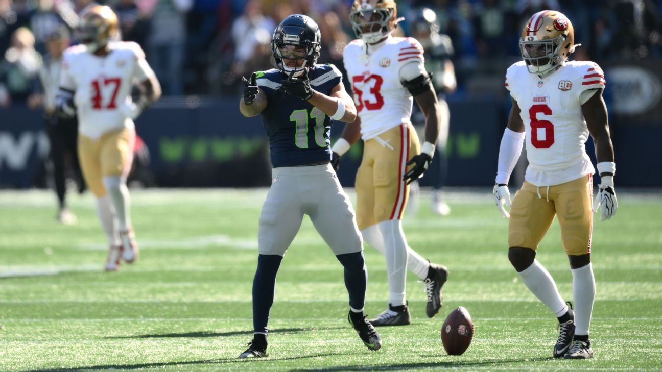 Jaxon Smith-Njigba celebrates a catch.
