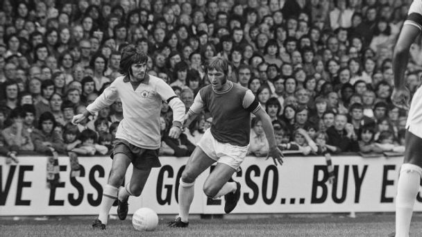 George Best takes on Billy Bonds as Manchester United play West Ham in Upton Park in the 1972-73 season.