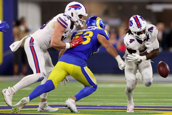 Bills running back James Cook (4) fumbles the ball after having it punched out by Rams linebacker Nate Landman (53) during the third quarter of Monday night's game in Los Angeles.