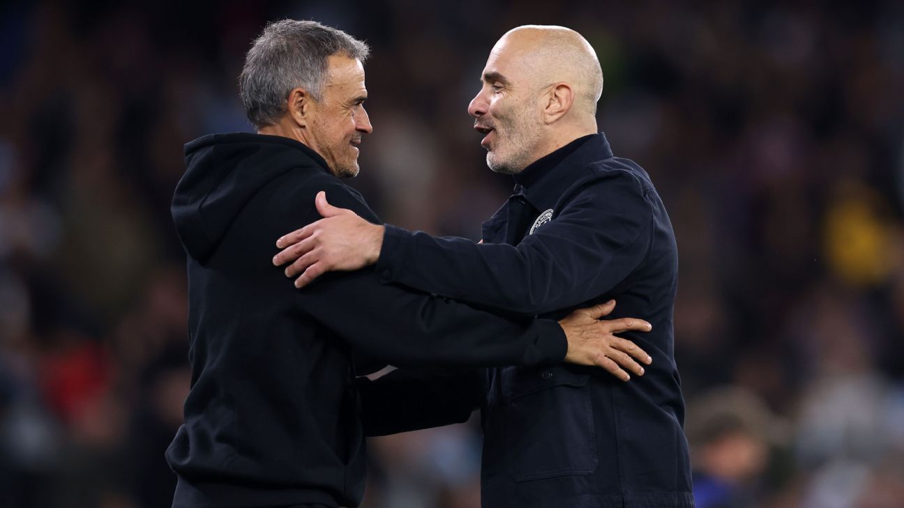Manchester City coach Enzo Maresca talks with is Paris Saint-Germain counterpart Luis Enrique following Wednesday's Champions League encounter. — Article image accompanying Maresca insists Man City 'close' to PSG after 2nd-half rally falls short on WagerUp Sports News.