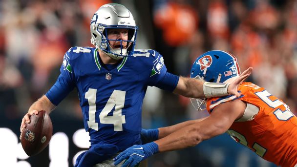 Seahawks QB Sam Darnold spent a lot of Thursday's game scrambling in and out of the pocket as he was sacked five times.