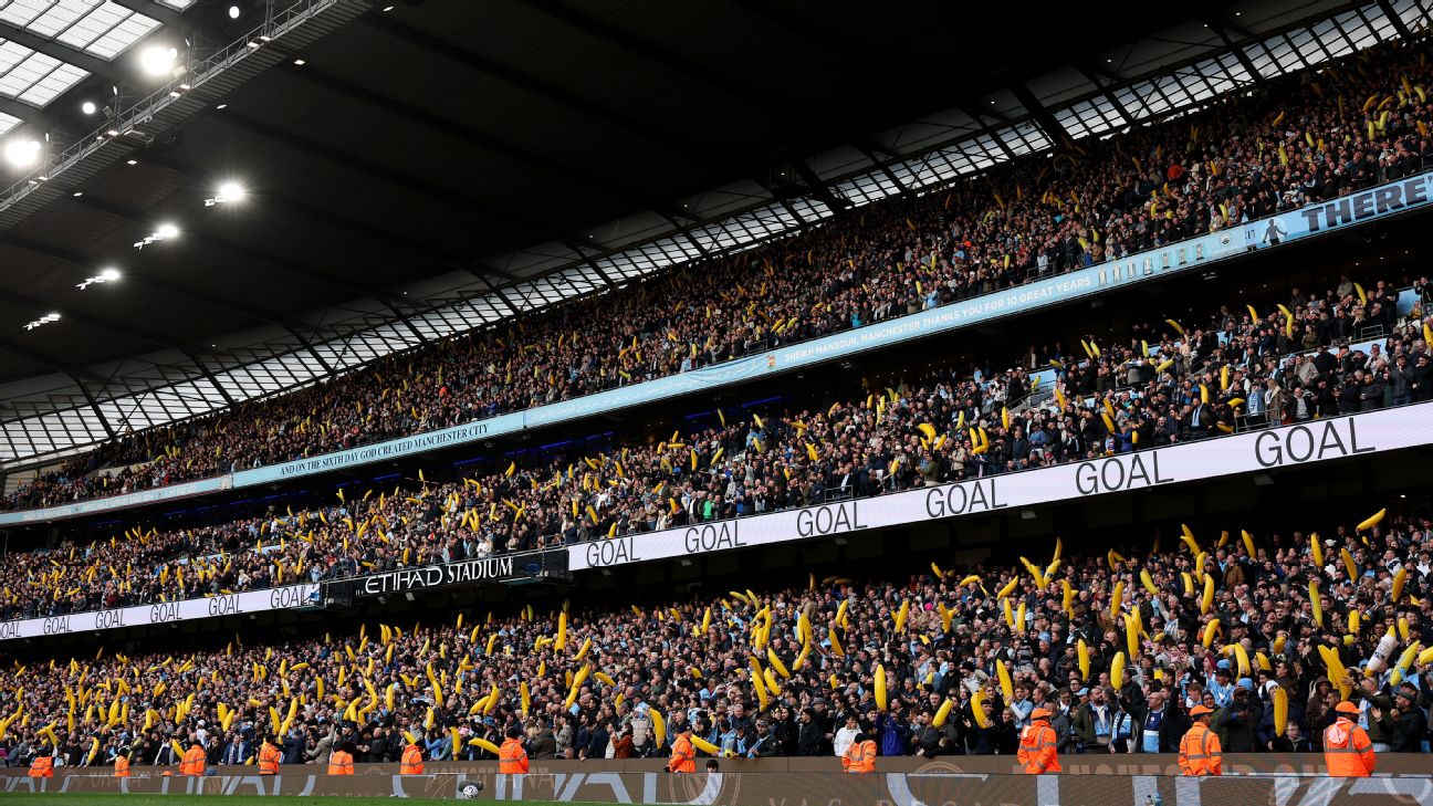 An inflatable banana has become a must-have accessory for home fans at the Etihad. — Article image accompanying Man City fans' inflatable banana craze sweeps defiant Etihad on WagerUp Sports News. An inflatable banana has become a must-have accessory for home fans at the Etihad. — Article image accompanying Man City fans' inflatable banana craze sweeps defiant Etihad on WagerUp Sports News.