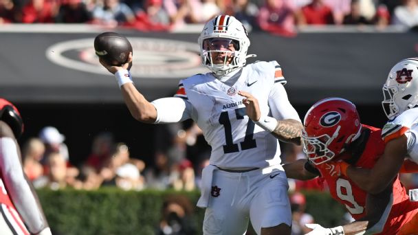 Quarterback Byrum Brown of the Auburn Tigers passes the ball during the college football game between Auburn and the Georgia Bulldogs on October 17, 2026, at Sanford Stadium in Ath