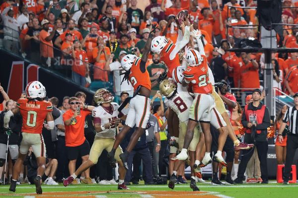 Hurricanes defensive back Bryce Fitzgerald (3) fights for possession of the ball in the end zone with Florida State wide receiver Duce Robinson in a play ultimately ruled a game-ending interception. — Article image accompanying FSU's Norvell says penalty in loss to Miami 'absolute joke' on WagerUp Sports News.