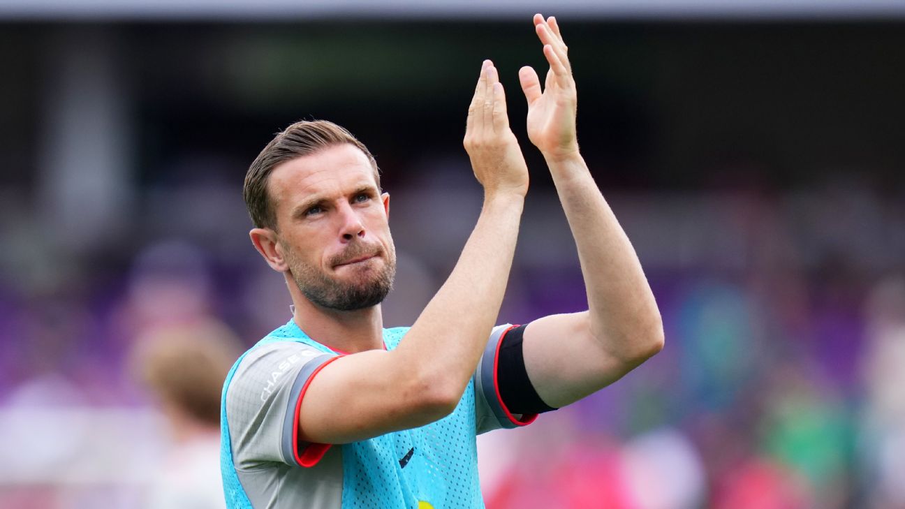 Jordan Henderson applauds.