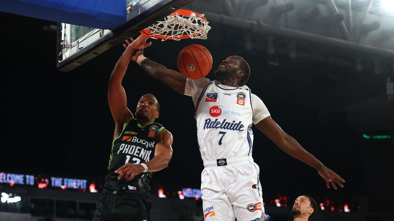 Yannis Morin of the Phoenix dunks under pressure from Mangok Mathaing of the 36ers — Article image accompanying Phoenix shoot the lights out to down the 36ers in NBL on WagerUp Sports News.