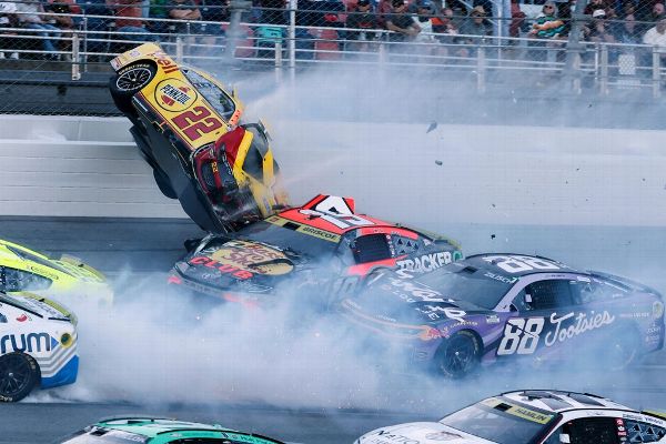 Joey Logano (22) flips after wrecking with Chase Briscoe (19) as a 15-car crash stopped the NASCAR Chase race at Talladega Speedway. — Article image accompanying Joey Logano's car goes airborne in scary 15-car wreck at Talladega on WagerUp Sports News.