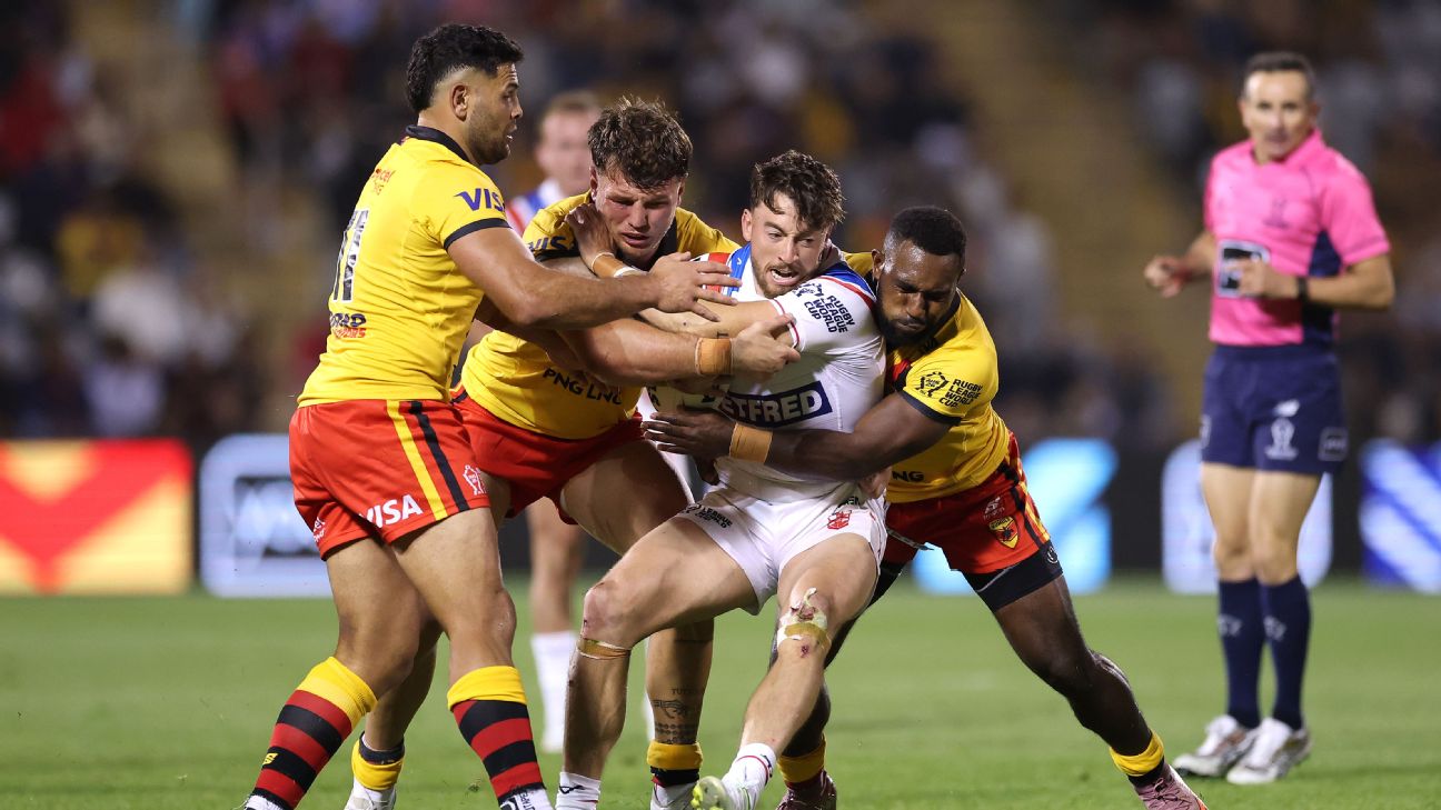 Matty Ashton of England is tackled — Article image accompanying England's World Cup all but over despite win over PNG on WagerUp Sports News.