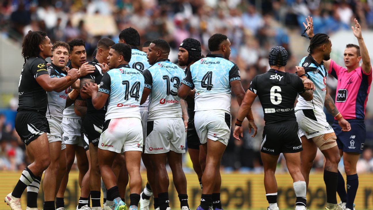 Brandon Wakeham of Fiji reacts after Ronaldo Mulitalo of New Zealand tackle Ronald Philitoga of Fiji high — Article image accompanying Double send off, punches thrown: Kiwis secure RLWC semi in fiery win on WagerUp Sports News. Brandon Wakeham of Fiji reacts after Ronaldo Mulitalo of New Zealand tackle Ronald Philitoga of Fiji high — Article image accompanying Double send off, punches thrown: Kiwis secure RLWC semi in fiery win on WagerUp Sports News.